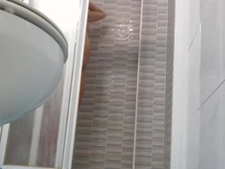Spying on beguiling Wife Shaving Pussy in Shower